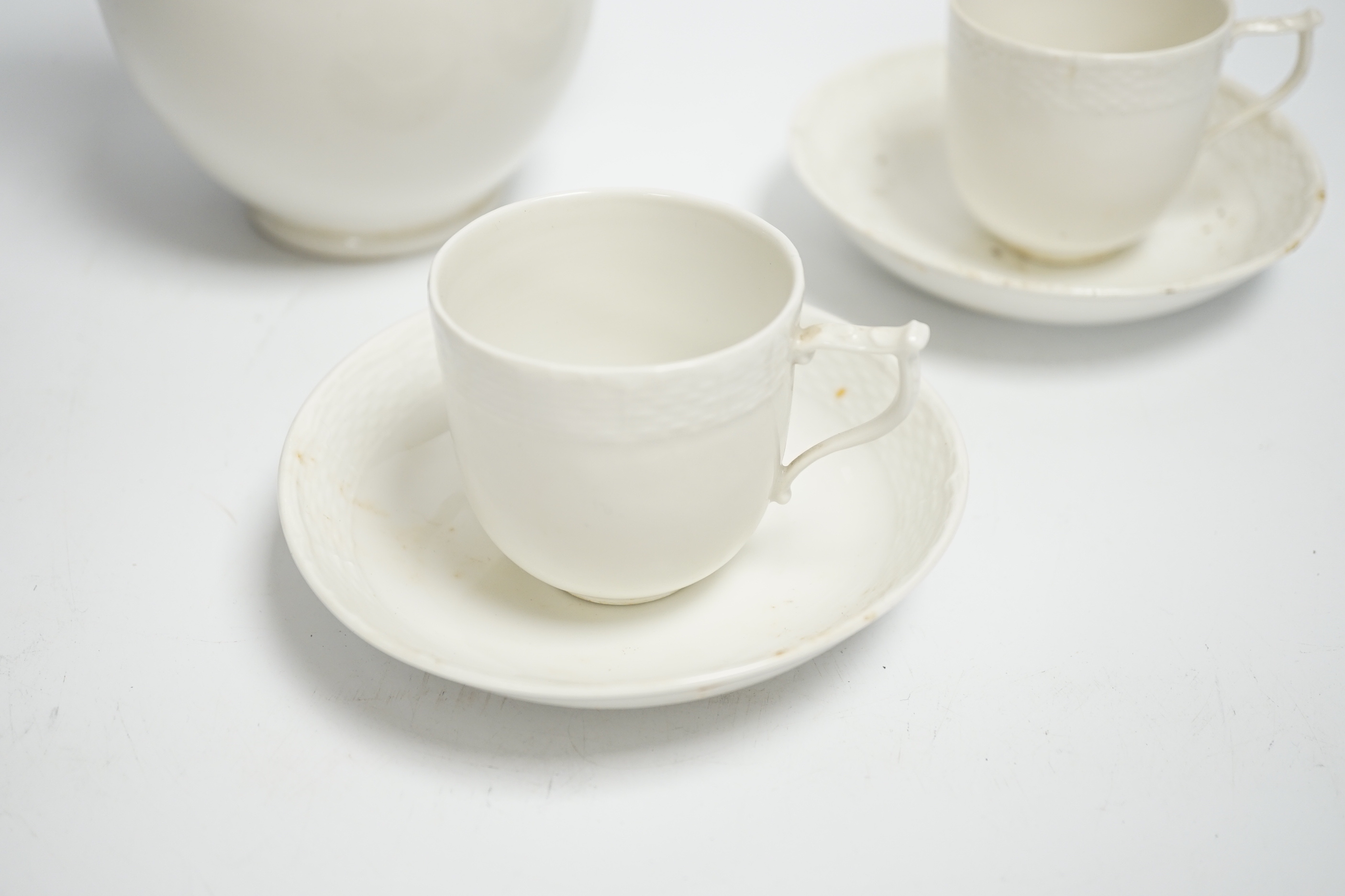 An early 20th century Berlin white glazed porcelain coffee set, tallest 21cm